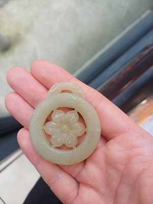 Lot 510 - A Chinese jade 'flower' pendant, 19th - 20th century