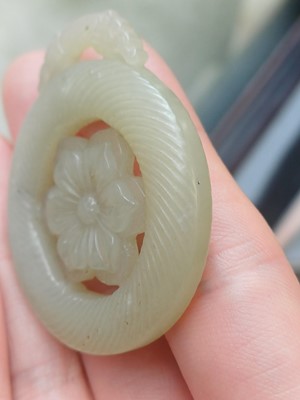 Lot 510 - A Chinese jade 'flower' pendant, 19th - 20th century