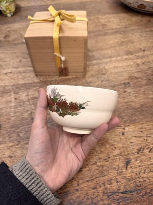 Lot 7 - A Japanese Satsuma 'chrysanthemum' tea bowl (chawan), signed Hashimoto Shozan