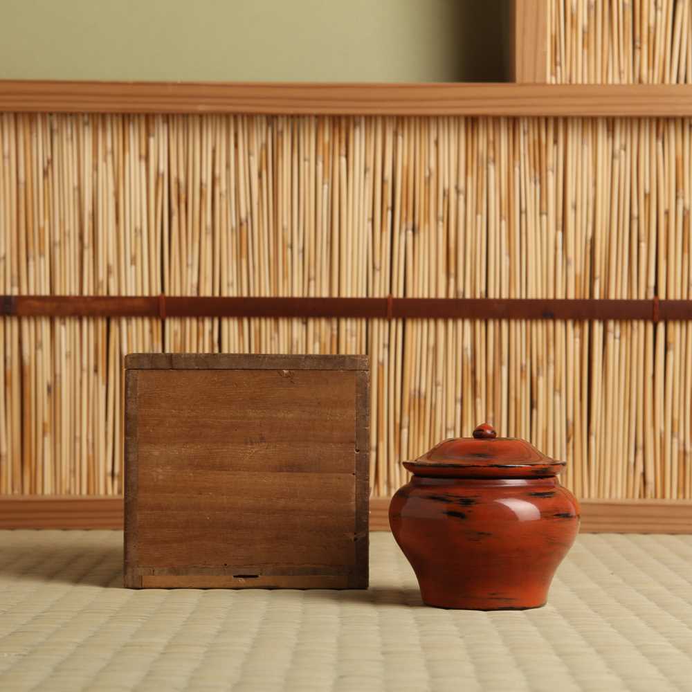 Lot 21 - A Japanese Negoro lacquer tea caddy (chazutsu), Edo period