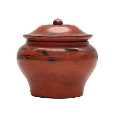 Lot 21 - A Japanese Negoro lacquer tea caddy (chazutsu), Edo period