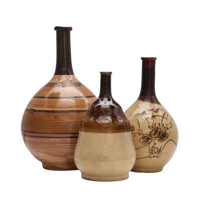 Lot 77 - Three Japanese Karatsu ware sake bottles (tokkuri), Edo - Meiji period