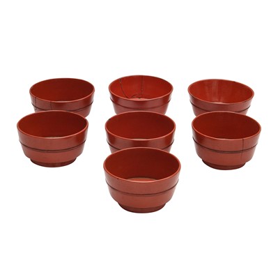 Lot 66 - A group of seven Japanese Negoro lacquer sake cups (guinomi), Edo period