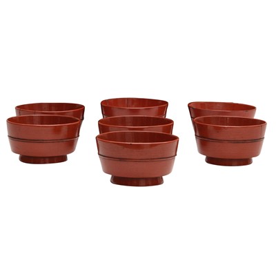 Lot 66 - A group of seven Japanese Negoro lacquer sake cups (guinomi), Edo period