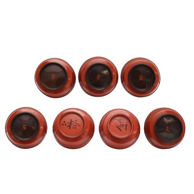 Lot 66 - A group of seven Japanese Negoro lacquer sake cups (guinomi), Edo period