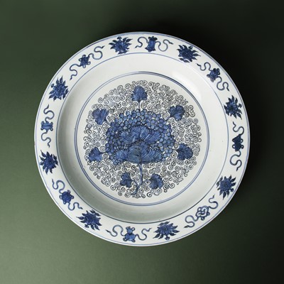 Lot 46 - A large Chinese blue and white ‘grape’ dish, Ming dynasty, Jiajing period