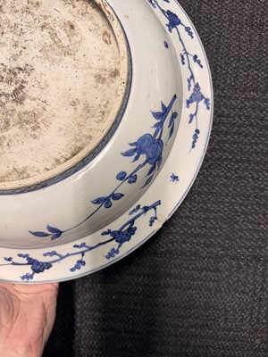 Lot 46 - A large Chinese blue and white ‘grape’ charger dish, Ming dynasty, Jiajing period