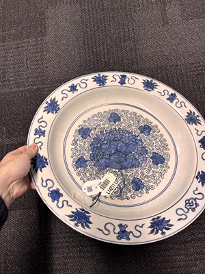 Lot 46 - A large Chinese blue and white ‘grape’ charger dish, Ming dynasty, Jiajing period