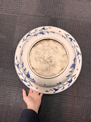 Lot 46 - A large Chinese blue and white ‘grape’ charger dish, Ming dynasty, Jiajing period