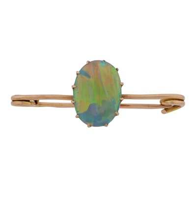 Lot 85 - A gold and opal bar brooch, circa 1920