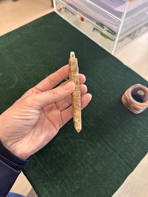Lot 527 - A Chinese jade awl-shaped pendant amulet, Neolithic period or later