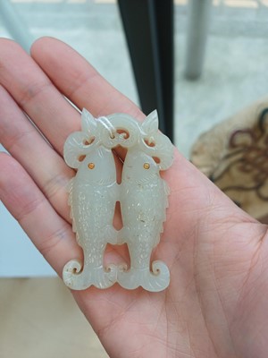 Lot 531 - A Chinese jade 'twin fish' pendant plaque, Qing dynasty