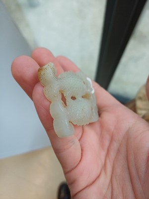 Lot 531 - A Chinese jade 'twin fish' pendant plaque, Qing dynasty