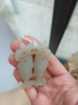 Lot 531 - A Chinese jade 'twin fish' pendant plaque, Qing dynasty