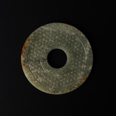 Lot 521 - A Chinese archaistic jade bi disc, 19th/20th century or earlier