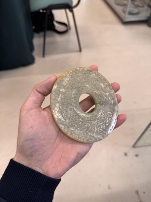 Lot 521 - A Chinese archaistic jade bi disc, 19th/20th century or earlier