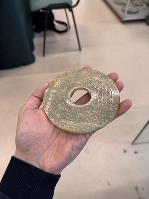 Lot 521 - A Chinese archaistic jade bi disc, 19th/20th century or earlier