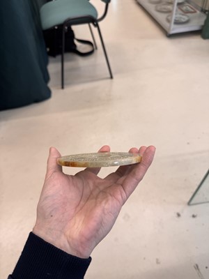 Lot 521 - A Chinese archaistic jade bi disc, 19th/20th century or earlier