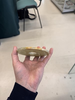 Lot 521 - A Chinese archaistic jade bi disc, 19th/20th century or earlier