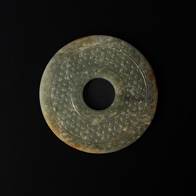 Lot 521 - A Chinese archaistic jade bi disc, 19th/20th century or earlier