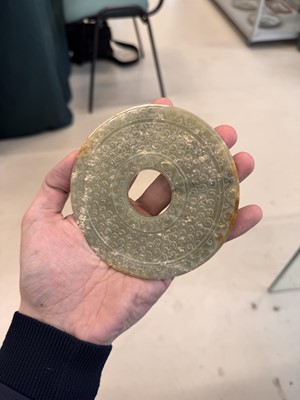 Lot 521 - A Chinese archaistic jade bi disc, 19th/20th century or earlier