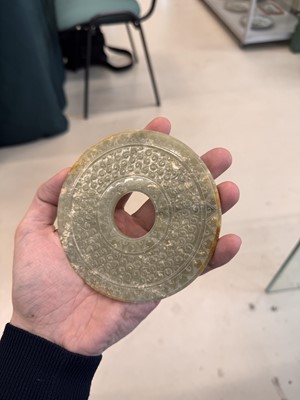 Lot 521 - A Chinese archaistic jade bi disc, 19th/20th century or earlier