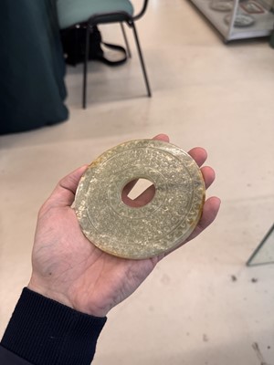 Lot 521 - A Chinese archaistic jade bi disc, 19th/20th century or earlier