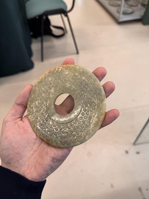 Lot 521 - A Chinese archaistic jade bi disc, 19th/20th century or earlier