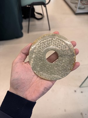 Lot 521 - A Chinese archaistic jade bi disc, 19th/20th century or earlier
