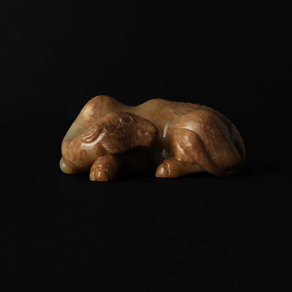 Lot 525 - A Chinese jade 'recumbent camel' figure, Song dynasty or later