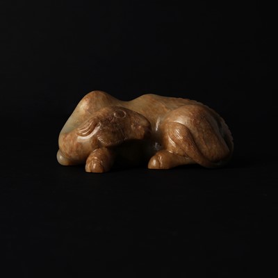 Lot 525 - A Chinese jade 'recumbent camel' figure, Song dynasty or later