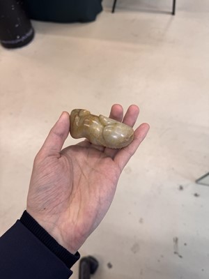 Lot 525 - A Chinese jade 'recumbent camel' figure, Song dynasty or later