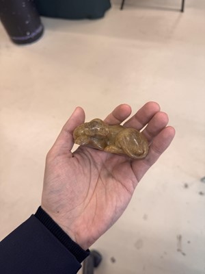 Lot 525 - A Chinese jade 'recumbent camel' figure, Song dynasty or later