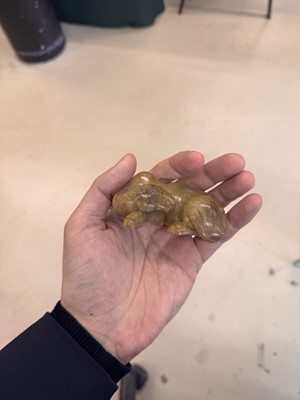 Lot 525 - A Chinese jade 'recumbent camel' figure, Song dynasty or later