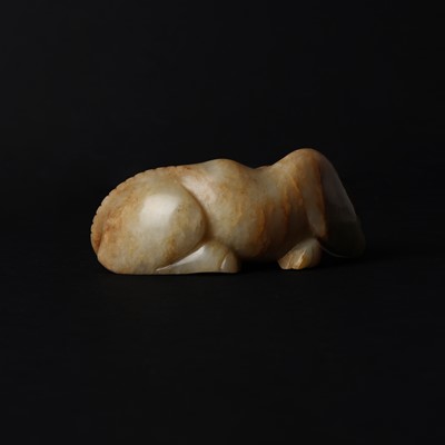 Lot 525 - A Chinese jade 'recumbent camel' figure, Song dynasty or later