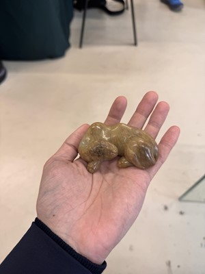 Lot 525 - A Chinese jade 'recumbent camel' figure, Song dynasty or later