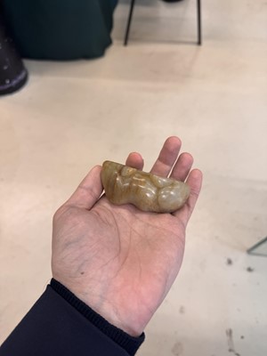 Lot 525 - A Chinese jade 'recumbent camel' figure, Song dynasty or later