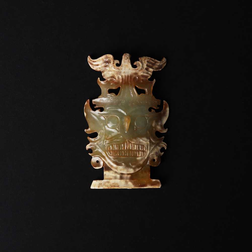 Lot 513 - A Chinese archaistic jade Shijiahe-style 'deity mask' group, 19th/20th century or earlier