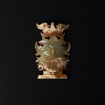 Lot 513 - A Chinese archaistic jade Shijiahe-style 'deity mask' group, 19th/20th century or earlier