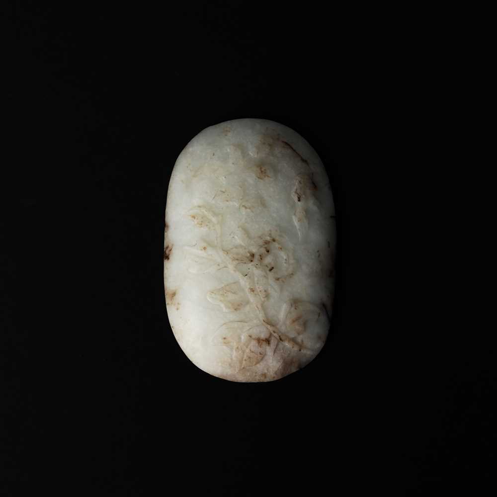Lot 511 - A chicken chicken-bone jade 'floral' plaque, 19th century