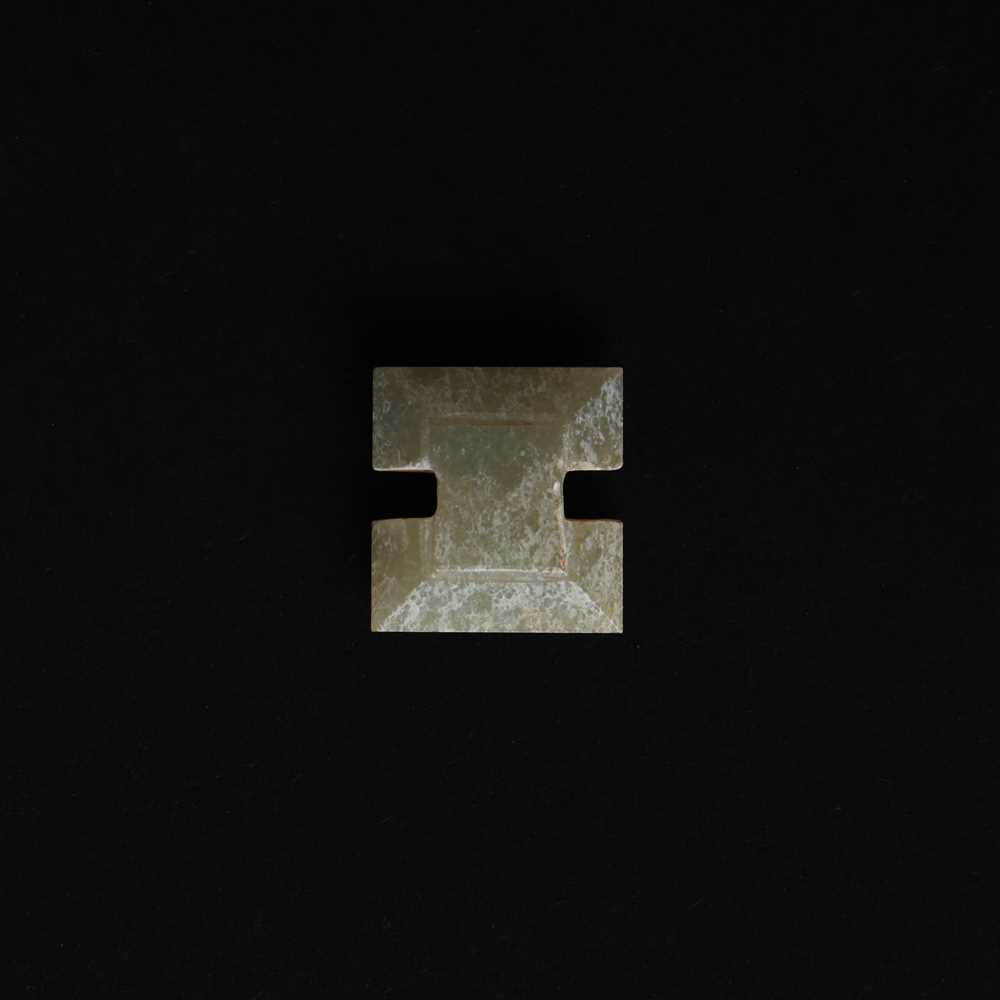 Lot 514 - A Chinese jade archaistic bead, 19th century or earlier