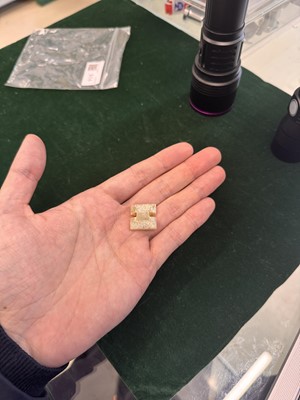 Lot 514 - A Chinese jade archaistic bead, 19th century or earlier