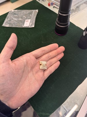 Lot 514 - A Chinese jade archaistic bead, 19th century or earlier
