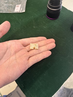 Lot 514 - A Chinese jade archaistic bead, 19th century or earlier