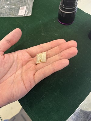 Lot 514 - A Chinese jade archaistic bead, 19th century or earlier