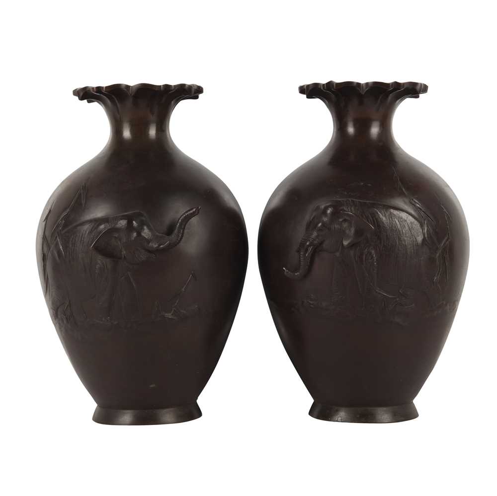 Lot 95 - A pair of Japanese bronze 'elephant' vases, Meiji period