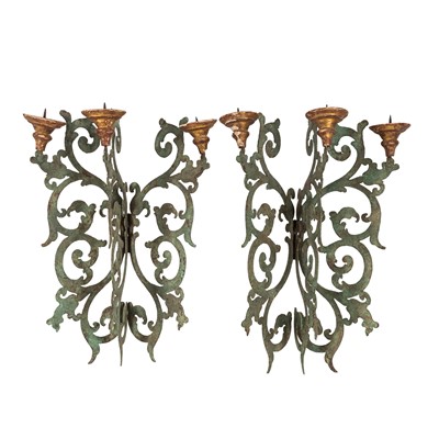 Lot 79 - A Pair of Continental wrought iron and giltwood three branch wall sconces, 18th / 19th century