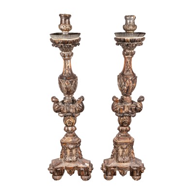 Lot 76 - A large pair of floor standing painted and silvered wood and gesso candlesticks, 18th century
