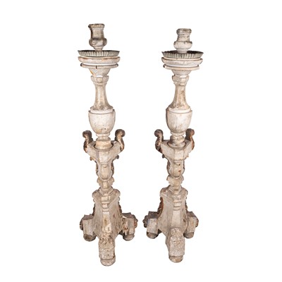 Lot 76 - A large pair of floor standing painted and silvered wood and gesso candlesticks, 18th century