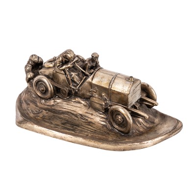 Lot 127 - An early 20th Century silver plated spelter racing car desk stand
